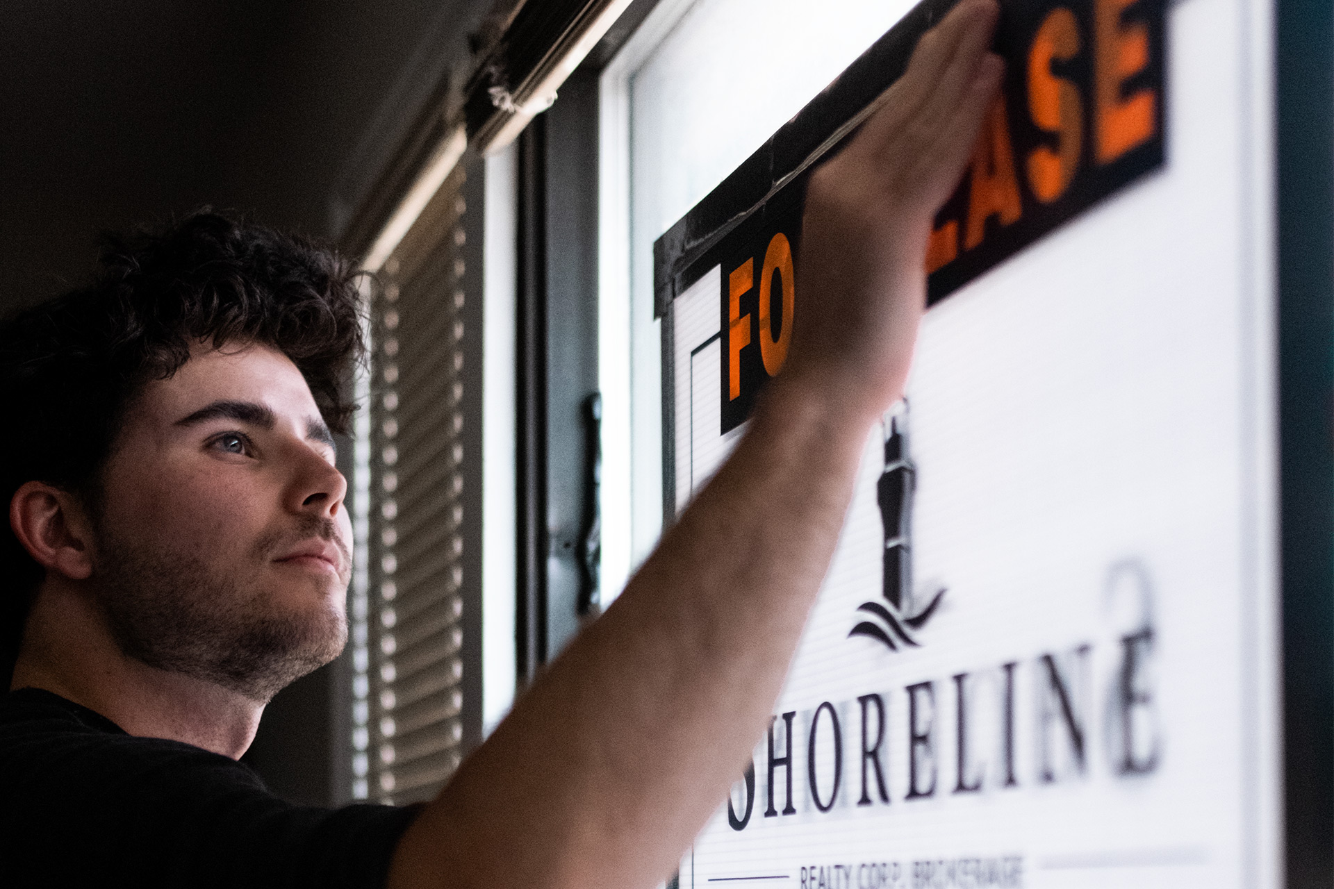 An image of Marco Pedri - Broker with Shoreline Realty Corp., Brokerage changing a "For Lease" sign to "Leased".