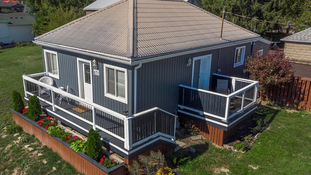 A drone image of small, cute bungalow perfect for downsizing.