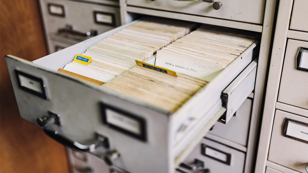 An image of a filing cabinet securely holding personal sensitive information against title fraud.