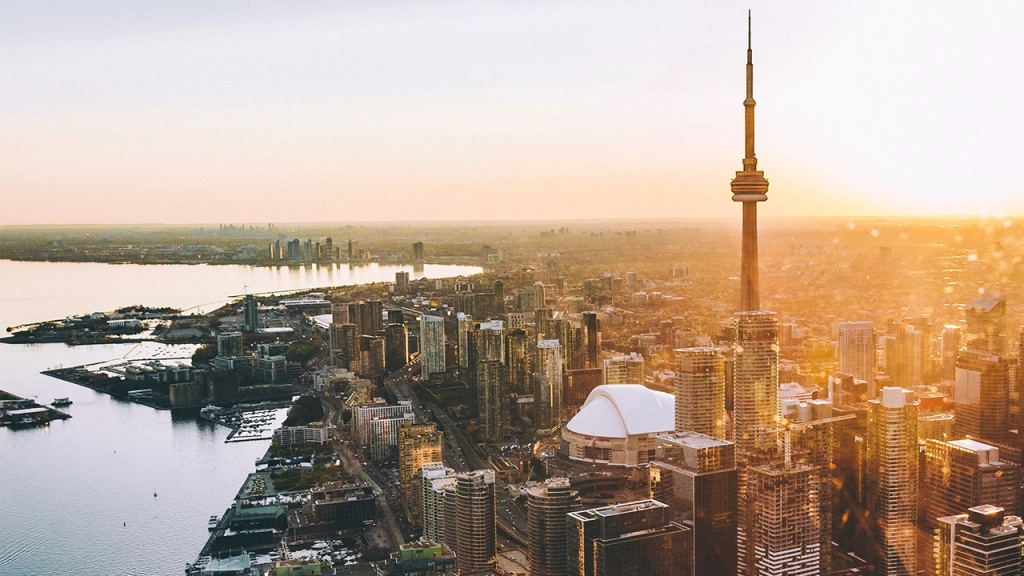 An image of the CN Tower located in Toronto, Ontario, Canada during the sunset taken from an airplane.