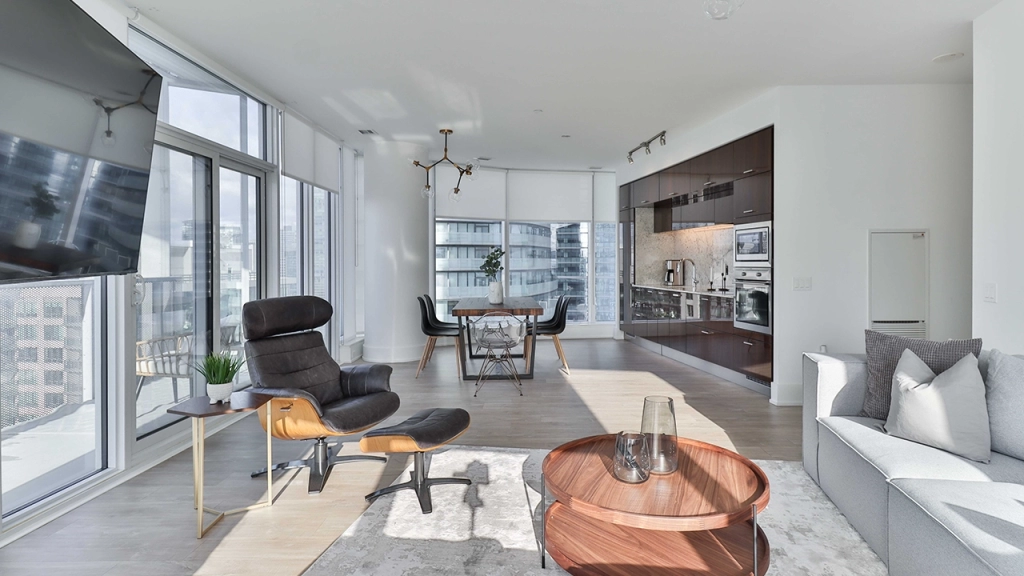 An interior image of a luxury condo living room which likely has high maintenance fees due to the large square footage.