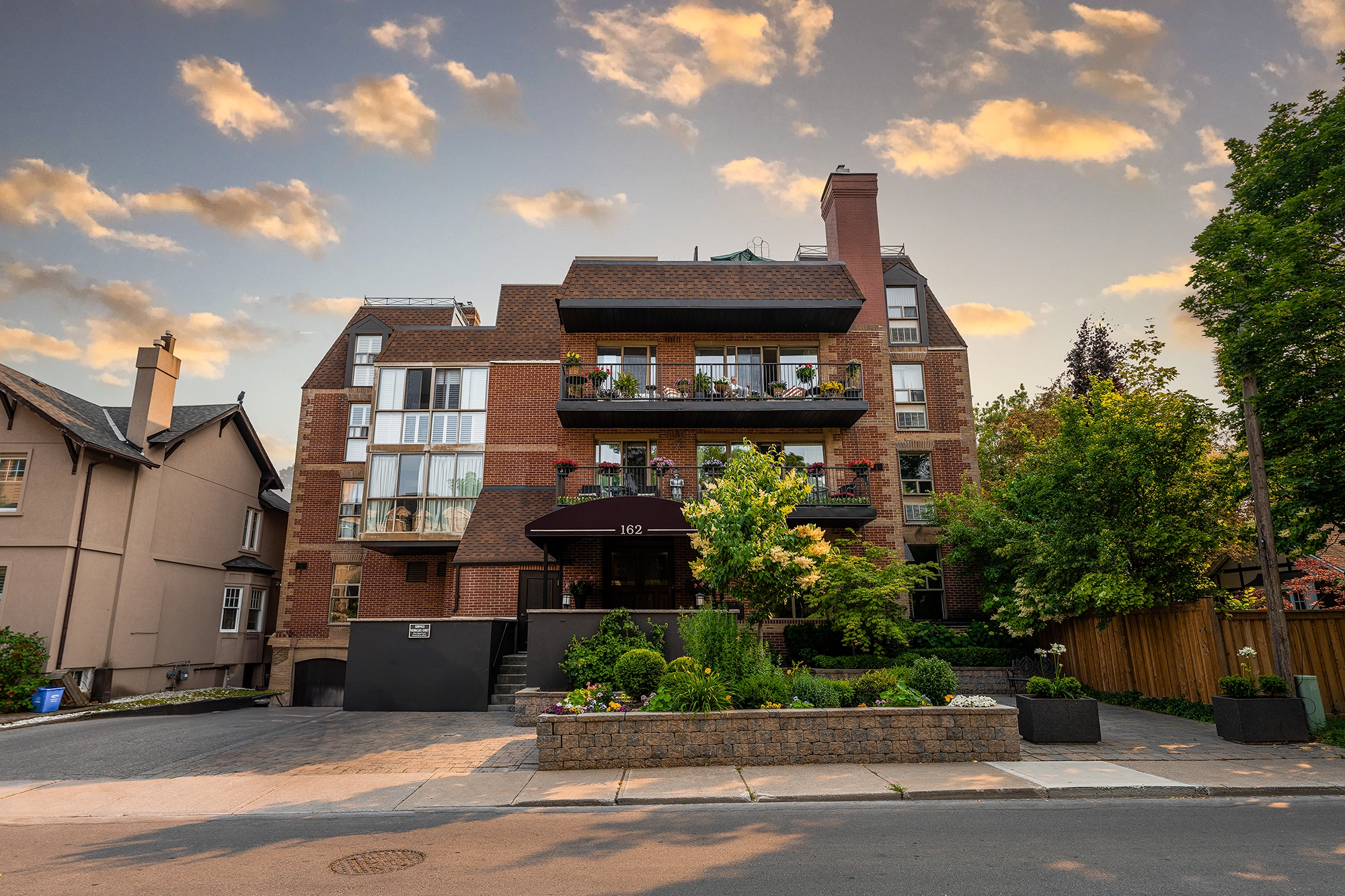 Exterior image of 162 Reynolds Street located in Oakville, Ontario, Canada taken during the summer of June 2023 during sunset