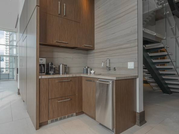 Interior image of 169 Fort York Blvd's upper penthouse showing the coffee bar with ice maker.