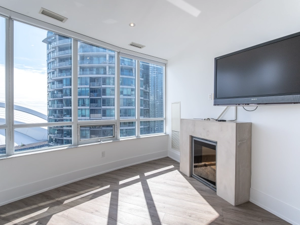 20 Blue Jays Way PH2 - primary bedroom with electric fireplace
