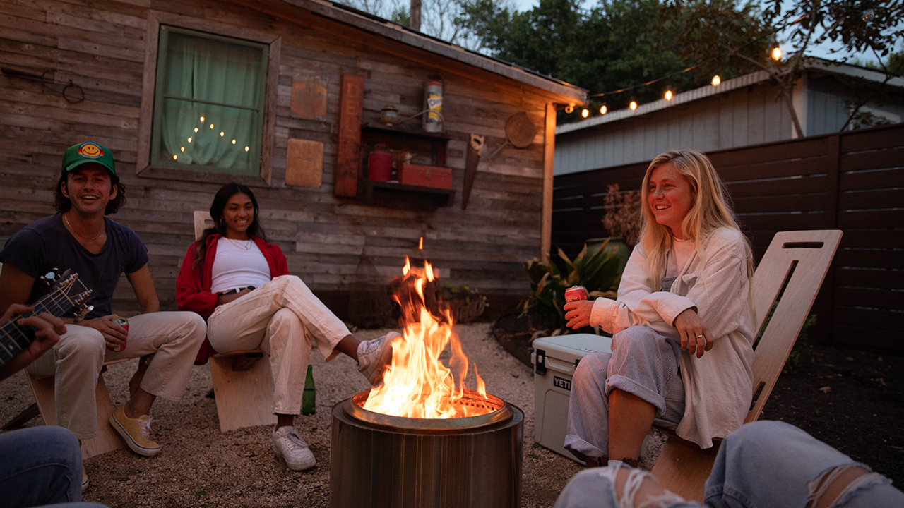 An image of people enjoying an outdoor firepit.