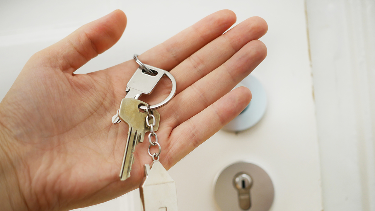 An image of a real estate key exchange.