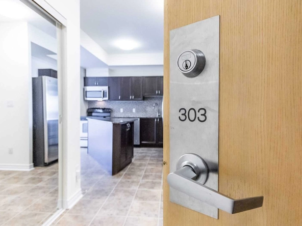 The door handle depicting unit 303 as you enter into the unit of 3865 Lake Shore Blvd West #303 - For Lease in Etobicoke.