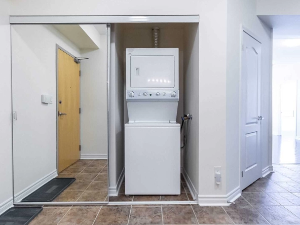 The stacked washer and dryer of 3865 Lake Shore Blvd West #303 - For Lease in Etobicoke.