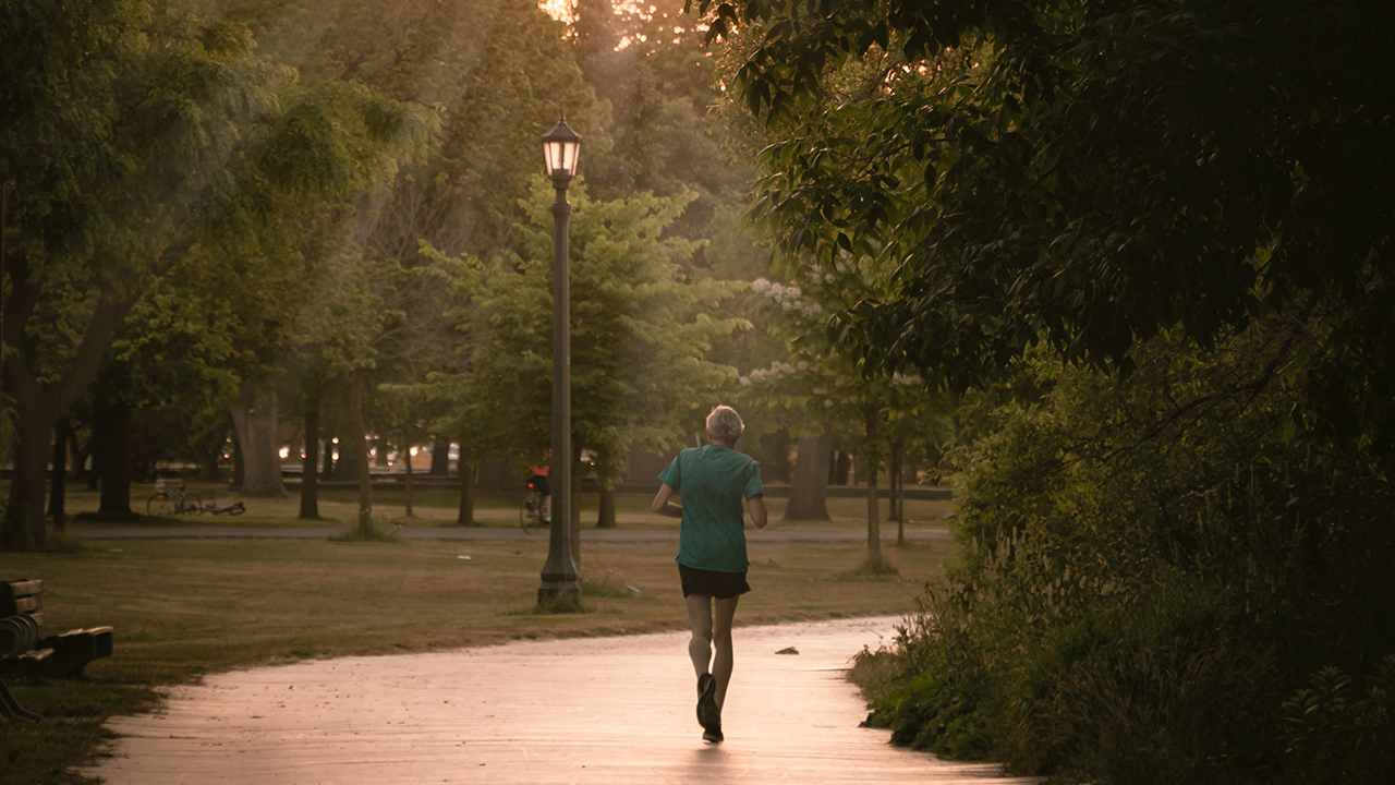 An image of an elderly man who moved to Etobicoke enjoying the many running trails Etobicoke has to offer.
