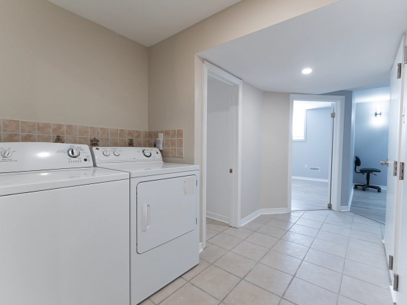 Laundry area facing the bedrooms of the basement apartment of 5467 Bimini Court located in Mississauga, Ontario, Canada