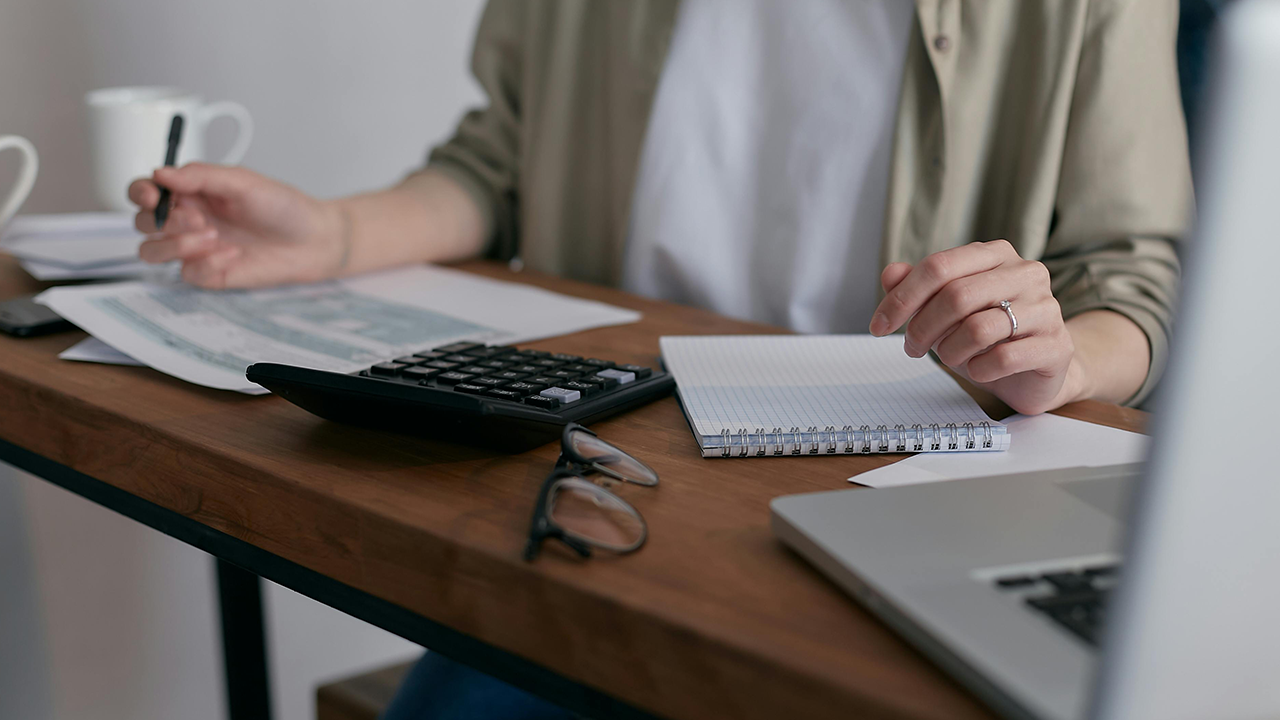 An image of a person calculating how to finance a duplex.