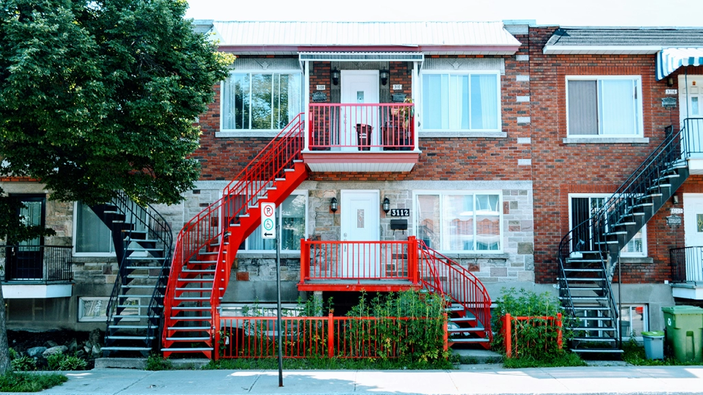 An exterior image and entrance of a duplex apartment