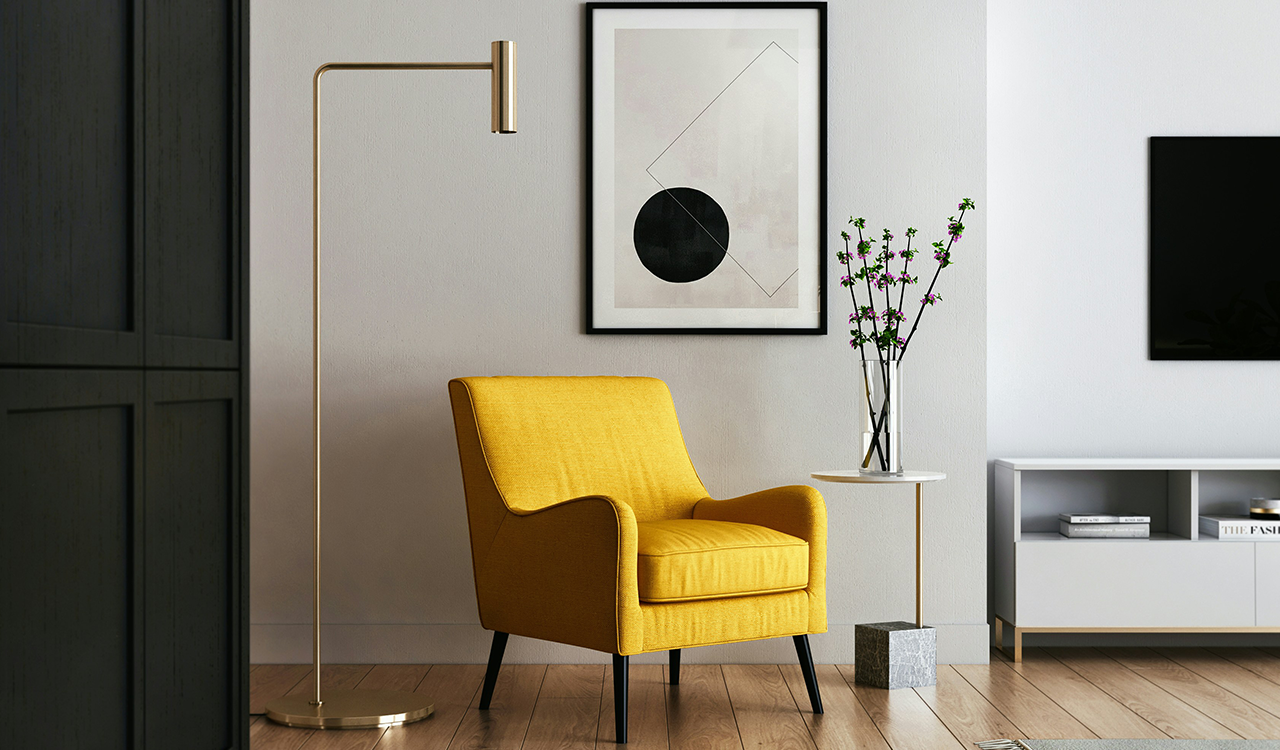 An image of a bright yellow chair in a living room.