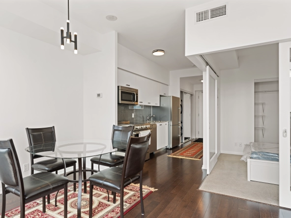 Dining room and kitchen at 832 Bay Street unit 4807 located in Toronto, Ontario, Canada.