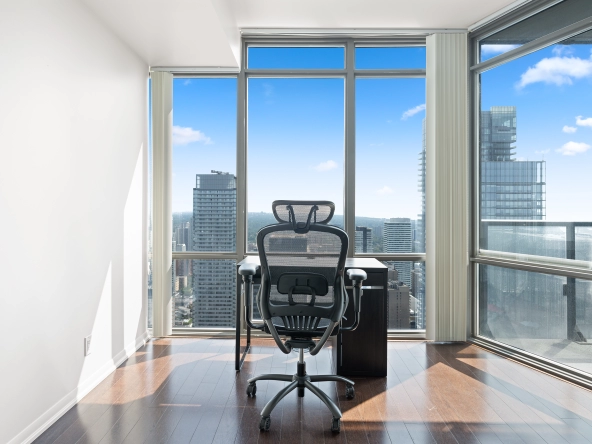 Image of the living room and dining room with floor to ceiling windows at 832 Bay Street unit 4807 located in Toronto, Ontario, Canada.