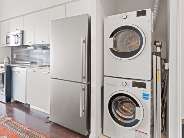 Fridge and laundry at 832 Bay Street unit 4807 located in Toronto, Ontario, Canada.