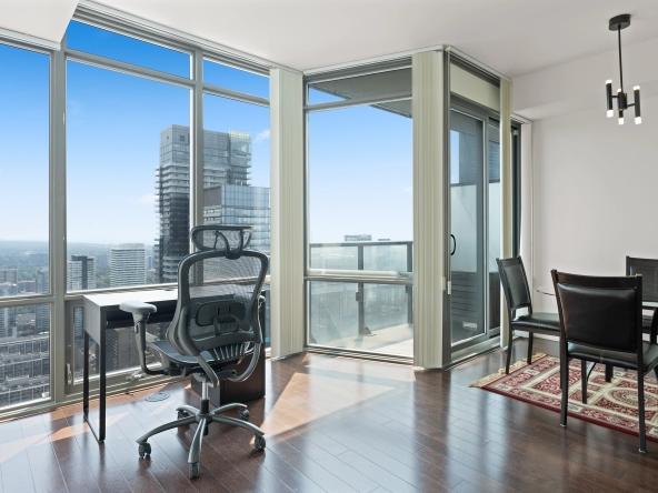 Image of the living room and dining room with floor to ceiling windows at 832 Bay Street unit 4807 located in Toronto, Ontario, Canada.