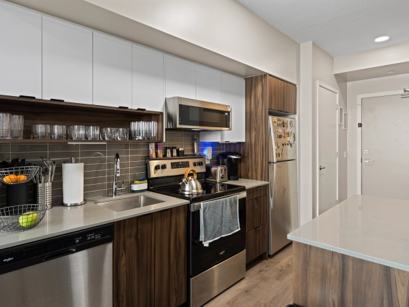 Kitchen and front entrance of 1117 Cooke Boulevard unit A107 located in the LaSalle neighbourhood of Burlington, Ontario, Canada. The unit is available for lease by Burlington rental agent, Marco Pedri.