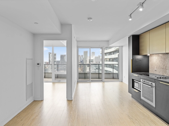 Eat-in kitchen looking into living room of 85 Wood Street unit 3717 - a 2 bedroom, 1 bathroom unit for lease in Toronto listed by Toronto Rental Agent Marco Pedri.