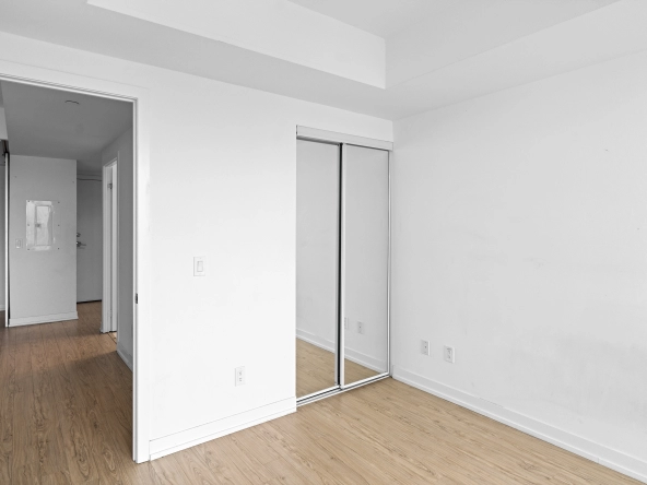 Primary bedroom closet of 85 Wood Street unit 3717 - a 2 bedroom, 1 bathroom unit for lease in Toronto listed by Toronto Rental Agent Marco Pedri.