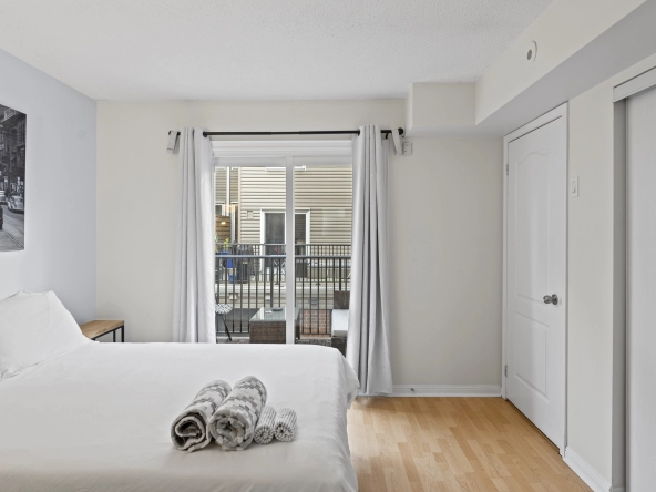 Bedroom with sliding doors of 96 Strachan Avenue located in the neighbourhood of Liberty Village in Toronto, Ontario currently listed for lease by Liberty Village real estate agent Marco Pedri.