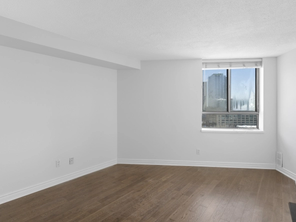 Primary bedroom located at 250 Queens Quay West unit 1208 - a Toronto condo for rent by real estate broker and Toronto rental agent Marco Pedri.