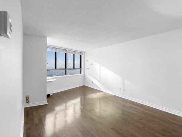 Living room located at 250 Queens Quay West unit 1208 - a Toronto condo for rent by real estate broker and Toronto rental agent Marco Pedri.