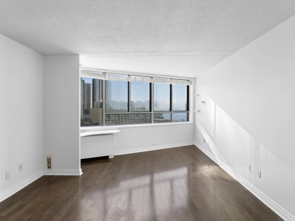 Living room located at 250 Queens Quay West unit 1208 - a Toronto condo for rent by real estate broker and Toronto rental agent Marco Pedri.