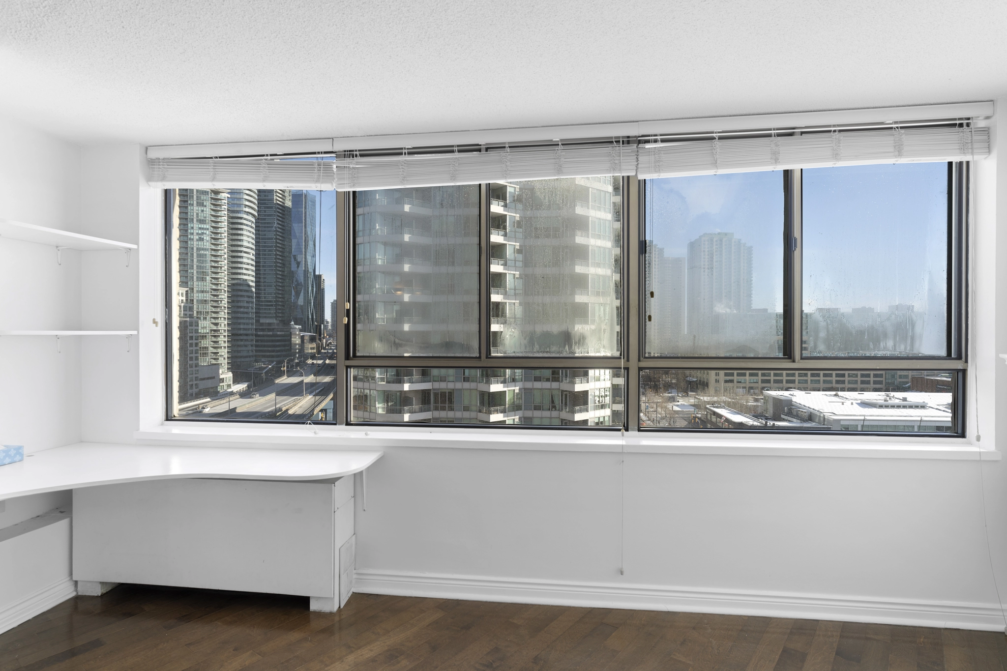 Living room windows located at 250 Queens Quay West unit 1208 - a Toronto condo for rent by real estate broker and Toronto rental agent Marco Pedri.