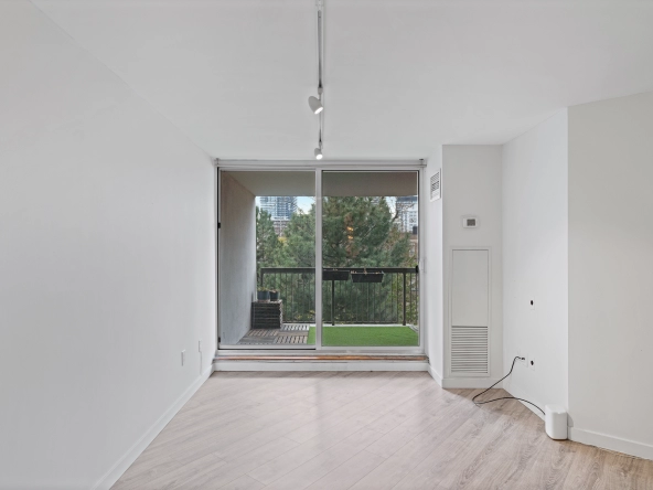 Living room with sliding doors onto balcony of 77 Maitland Place unit 525 located in Toronto, Ontario, Canada - a condo currently for lease by Toronto rental agent Marco Pedri.