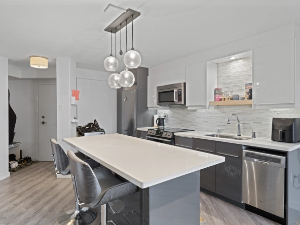 Kitchen and breakfast bar of 77 Maitland Place unit 525 located in Toronto, Ontario, Canada - a condo currently for lease by Toronto rental agent Marco Pedri.