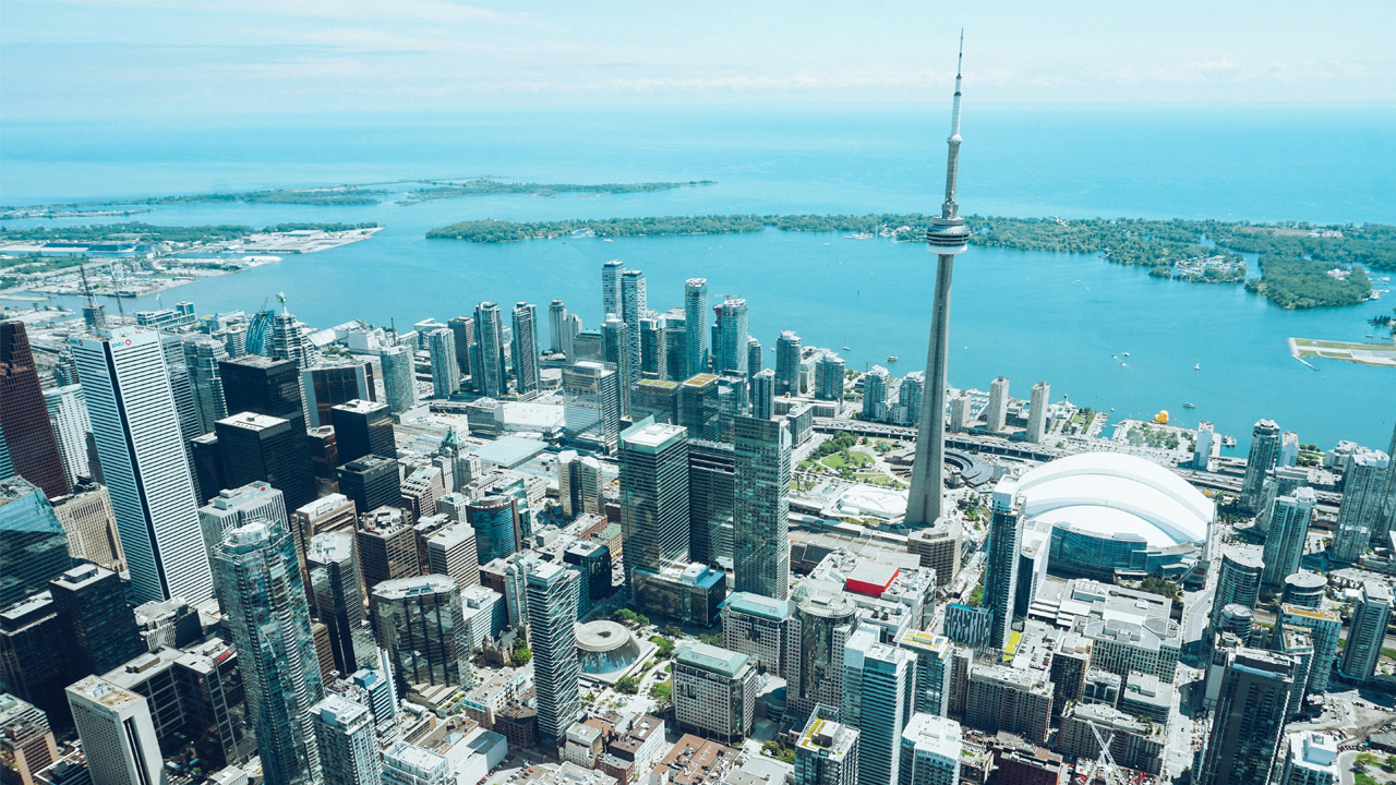 An image of Toronto from the sky overlooking the various neighbourhoods.