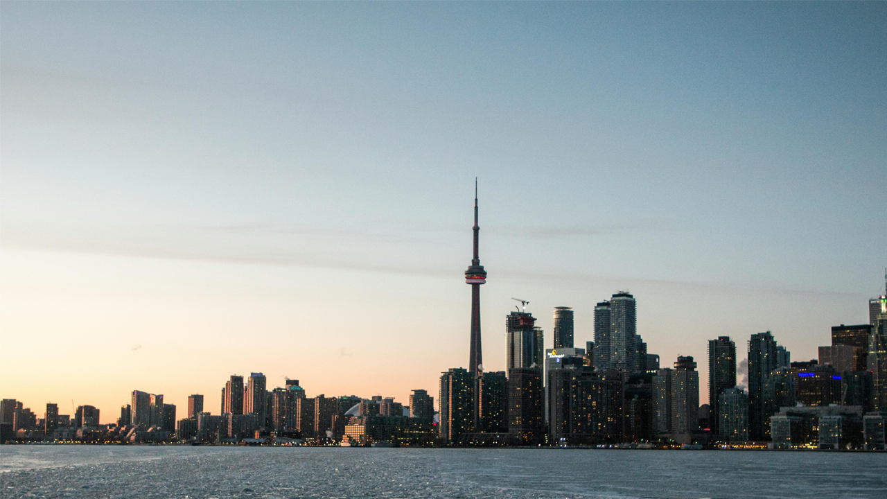 An image of the Toronto skyline - a key city where it might be a smart investment to buy a fourplex.
