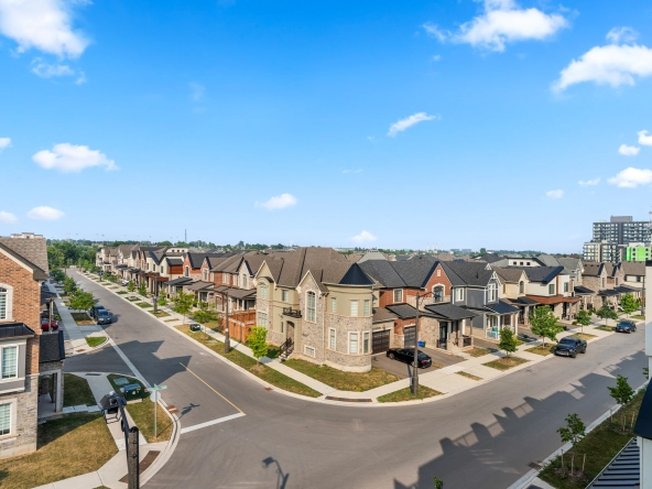 An image overlooking a subdivision of homes.