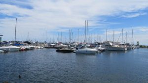 An image of the harbour of Port Credit with a boat which illustrates the real cost of living in Port Credit.